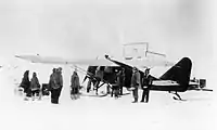 Wop May loads his airplane at Aklavik