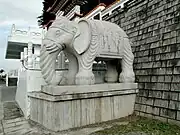 A statue of a white elephant in front of SyuentzangTemple.