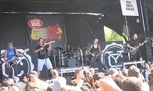 Yellowcard performing on Warped Tour 2012 (L-R: Josh Portman, Sean Mackin, Longnieu Parsons III, Ryan Key and Ryan Mendez)