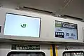 LCD passenger information screens above the doorways