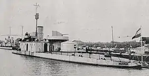 an armoured riverine ship with turrets and guns