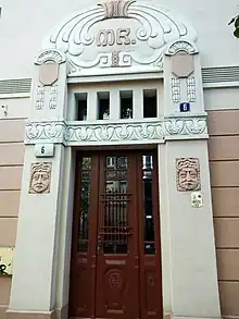 Ornamented portal with MK initials