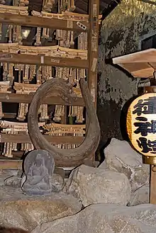 Wooden snake at Zeniarai Benzaiten Ugafuku Shrine