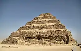 A series of five setbacks, each of decreasing size, result in the pyramid being much narrower at its peak than at its base.