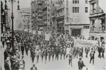 Hundreds of African Americans peacefully parading down 5th avenue in New York, holding signs of protest