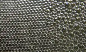 Hexagonal order of bubbles in a foam.